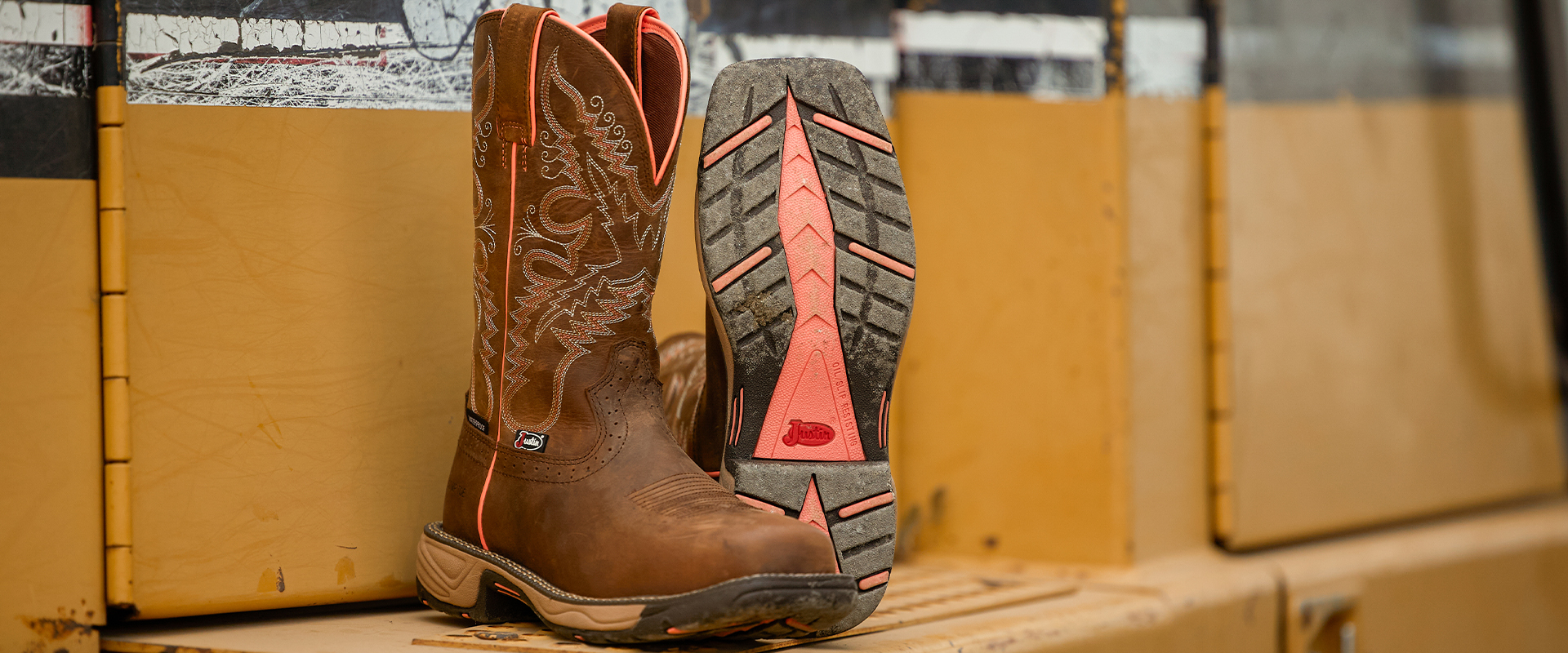 A pair of women's Rush boots in Rural Chocolate (SE4357) on the side of a construction truck.